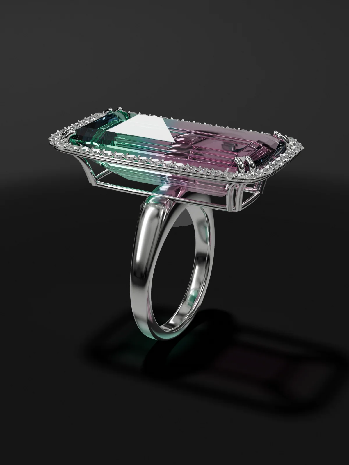 Design concept: the bicolor tourmaline in an 18k white gold ring with a diamond halo