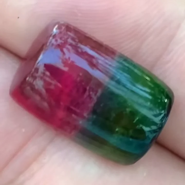 24.42 ct watermelon tourmaline cushion cabochon in the hand